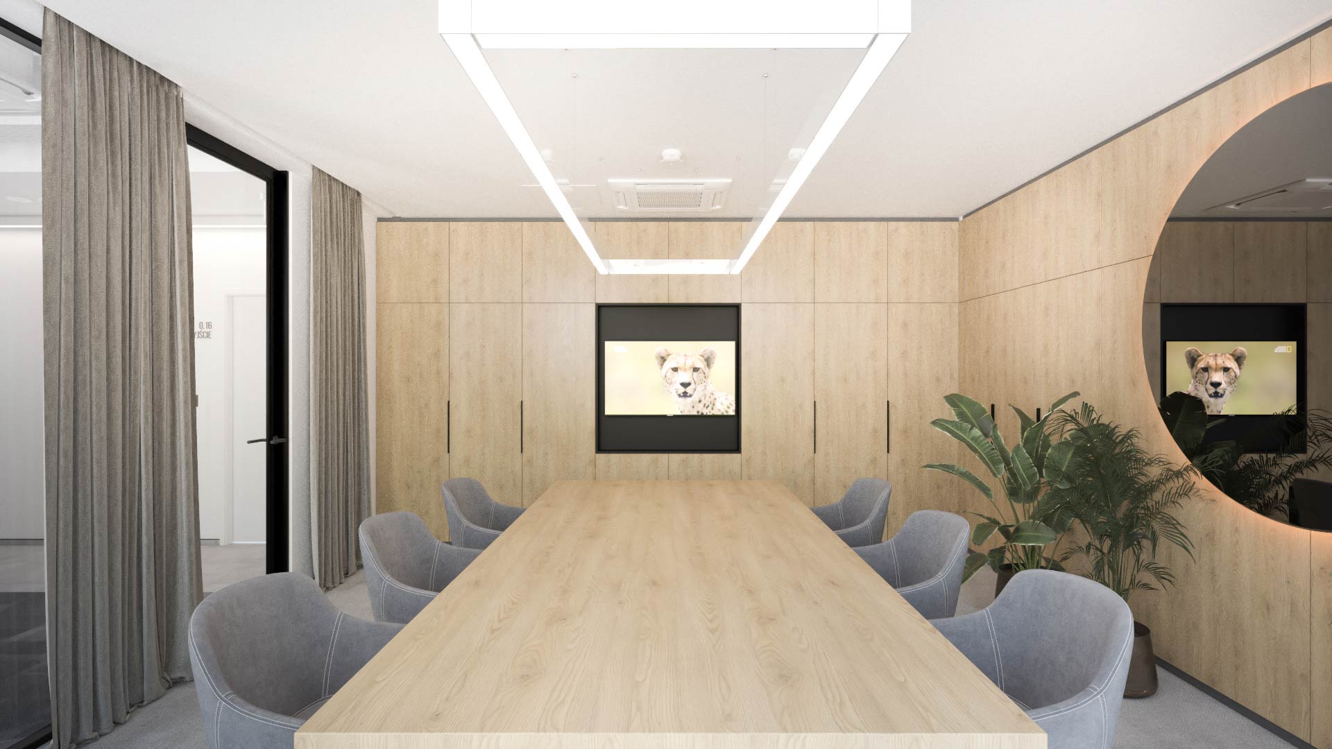 Sala konferencyjna z drewnianą zabudową, stołem i okrągłym lustrem